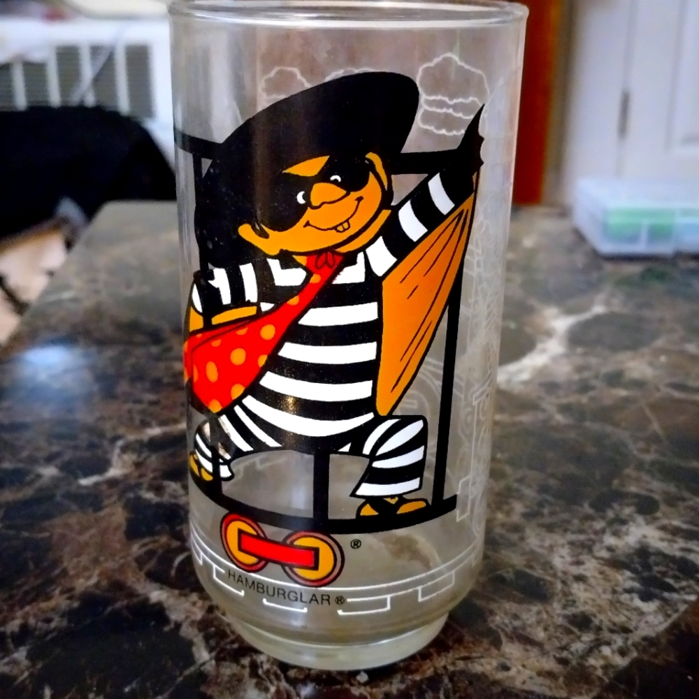 McDonald's Hamburglar Glass with Black, Orange, and Red Design